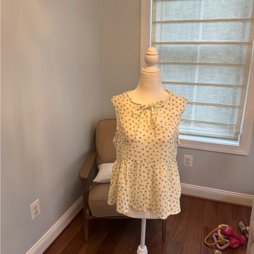 Floral Cream Sleeveless Top never worn from social threads !!